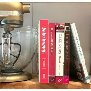 Cute Pile of Cook Books Cake Pops Cupcakes Cakes and No Bake Pink White Brown